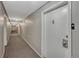 Neutral hallway with doors and carpet at 1243 Gaylord St # 410, Denver, CO 80206