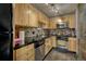 Well-equipped kitchen with stainless steel appliances, tile backsplash, and ample cabinet space at 1243 Gaylord St # 410, Denver, CO 80206