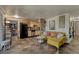 Open living space with a modern kitchen, yellow sofa, and unique tile floors at 1243 Gaylord St # 410, Denver, CO 80206