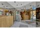 The building's entrance lobby features wood paneling and direct sunlight, creating an open concept space at 1243 Gaylord St # 410, Denver, CO 80206