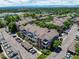 Aerial view of multi-Gathering residential complex with mature landscaping, parking, and mountain views in the background at 2428 W 82Nd Pl # 1D, Westminster, CO 80031