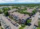 Aerial view of multi-Gathering residential complex with mature landscaping, parking, and mountain views in the background at 2428 W 82Nd Pl # 1D, Westminster, CO 80031