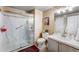 Well-lit bathroom showcasing a glass shower, modern toilet, vanity with mirror, and a clean, contemporary design at 2428 W 82Nd Pl # 1D, Westminster, CO 80031