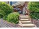 A well-manicured pathway and greenery lead to the entrance of unit 1D at 2428 W 82Nd Pl # 1D, Westminster, CO 80031