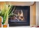 Modern black fireplace with roaring flames at 2428 W 82Nd Pl # 1D, Westminster, CO 80031