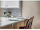Quartz countertops with gray backsplash on kitchen counter with seating at 2428 W 82Nd Pl # 1D, Westminster, CO 80031