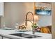 Stainless steel kitchen sink with a modern pull-down faucet at 2428 W 82Nd Pl # 1D, Westminster, CO 80031