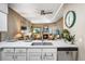 Open living room with fireplace and dining space, perfect for entertaining at 2428 W 82Nd Pl # 1D, Westminster, CO 80031
