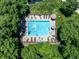 Aerial view of a refreshing community pool surrounded by lush greenery at 2428 W 82Nd Pl # 1D, Westminster, CO 80031