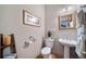 Small bathroom with pedestal sink and decorative accents at 8174 Inca Rd, Larkspur, CO 80118