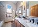 Elegant bathroom with double vanity and granite countertop at 8174 Inca Rd, Larkspur, CO 80118