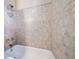Clean bathroom with shower/tub combo and tile surround at 8174 Inca Rd, Larkspur, CO 80118