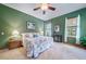 Bright bedroom with floral bedding and mountain views at 8174 Inca Rd, Larkspur, CO 80118
