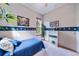 Charming bedroom with full-size bed and custom wall art at 8174 Inca Rd, Larkspur, CO 80118