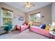 Cozy bedroom with two twin beds and forest views at 8174 Inca Rd, Larkspur, CO 80118