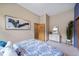 Serene bedroom with a dresser and large window at 8174 Inca Rd, Larkspur, CO 80118