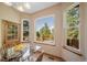 Bright breakfast nook with a glass table and large windows offering scenic views at 8174 Inca Rd, Larkspur, CO 80118