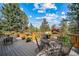Large deck with mountain views and seating for entertaining at 8174 Inca Rd, Larkspur, CO 80118