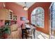 Dining room with built-in cabinetry and large window at 8174 Inca Rd, Larkspur, CO 80118