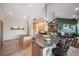 Open kitchen with a breakfast bar, granite countertops, and views into the living area at 8174 Inca Rd, Larkspur, CO 80118