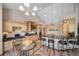 Bright kitchen showcasing granite countertops, light wood cabinetry, and a breakfast bar at 8174 Inca Rd, Larkspur, CO 80118