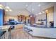 Gourmet kitchen with granite counters, ample cabinetry, and breakfast bar at 8174 Inca Rd, Larkspur, CO 80118