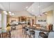 Well-equipped kitchen with custom cabinetry, granite countertops, and a breakfast bar at 8174 Inca Rd, Larkspur, CO 80118