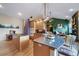 Island kitchen with granite countertops and stainless steel appliances at 8174 Inca Rd, Larkspur, CO 80118