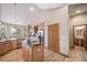 Open kitchen featuring stainless steel appliances, granite countertops and an eat-in island at 8174 Inca Rd, Larkspur, CO 80118