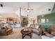 Inviting living room showcasing an open floor plan, vaulted ceilings, and a comfortable seating area at 8174 Inca Rd, Larkspur, CO 80118