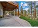 Spacious patio with mountain views and grassy area at 8174 Inca Rd, Larkspur, CO 80118