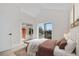 Bright bedroom with walk-in closet, large window, and neutral decor at 1907 W Elk Pl, Denver, CO 80211