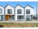 Contemporary townhome showcasing a modern design, clean lines, and inviting curb appeal on a sunny day at 1907 W Elk Pl, Denver, CO 80211