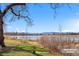 Picturesque lake view showcasing the tranquil scenery with distant mountain views and natural landscape at 1907 W Elk Pl, Denver, CO 80211