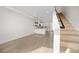 Open concept living space showcasing the kitchen, dining, and staircase at 1907 W Elk Pl, Denver, CO 80211