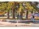A picturesque park featuring lush green spaces, mature trees, and recreational amenities for all ages at 1907 W Elk Pl, Denver, CO 80211