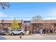 Street view of a trendy restaurant with outdoor seating, showcasing its inviting and modern storefront at 1907 W Elk Pl, Denver, CO 80211