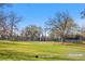 Well-maintained tennis courts surrounded by lush greenery, providing an active recreational space at 1907 W Elk Pl, Denver, CO 80211