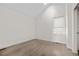 Bright bedroom with vaulted ceilings, skylight and a large window at 1907 W Elk Pl, Denver, CO 80211