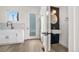Bright kitchen with stainless steel refrigerator and modern black faucet overlooking the backyard at 1907 W Elk Pl, Denver, CO 80211