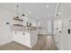 Modern kitchen with white cabinets, stainless appliances, and a stylish island at 1907 W Elk Pl, Denver, CO 80211