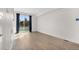 Bright living room with hardwood floors and a large window allowing natural light at 1907 W Elk Pl, Denver, CO 80211