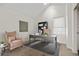Bright home office with vaulted ceilings, skylight, gray desk and chair at 1907 W Elk Pl, Denver, CO 80211