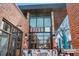 Inviting view of the restaurant's brick exterior with large windows and comfortable outdoor seating area at 1907 W Elk Pl, Denver, CO 80211