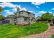 Beautiful home exterior with a large green lawn and professional landscaping at 8286 W 108Th Pl, Broomfield, CO 80021