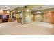 A spacious basement with carpet flooring and a wet bar at 8286 W 108Th Pl, Broomfield, CO 80021