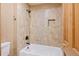 A beautifully tiled shower and tub combination bathroom featuring a sleek shower head at 8286 W 108Th Pl, Broomfield, CO 80021