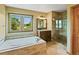 Luxurious bathroom with a soaking tub and a separate glass-enclosed shower at 8286 W 108Th Pl, Broomfield, CO 80021