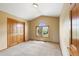 Bright bedroom with closet, arched window, and plush carpeting at 8286 W 108Th Pl, Broomfield, CO 80021