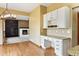 Dining area with a built-in desk and view of the fireplace at 8286 W 108Th Pl, Broomfield, CO 80021